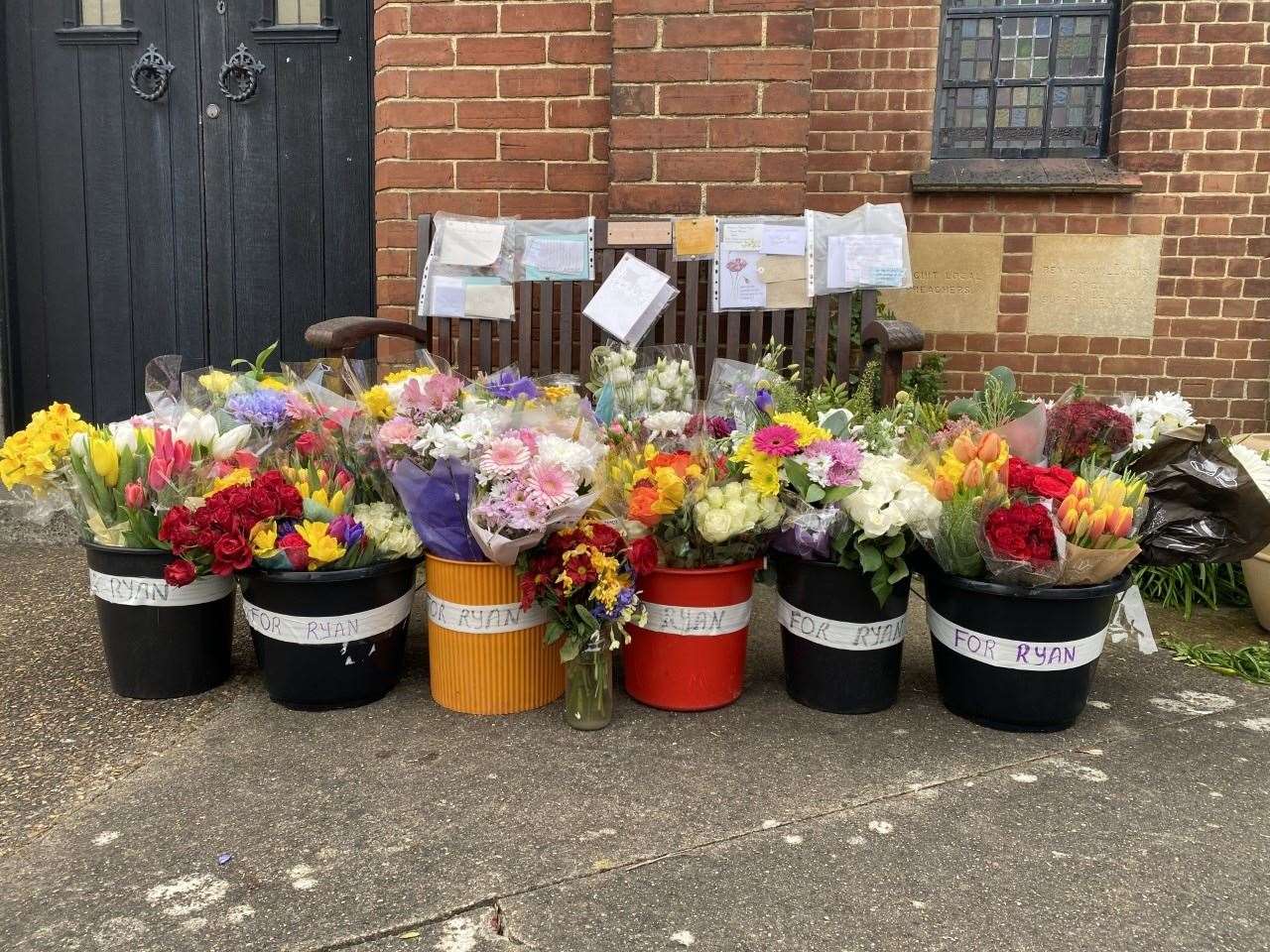 Tributes to Ryan Hughes outside of the Church of Eccles. Picture Ben Austin