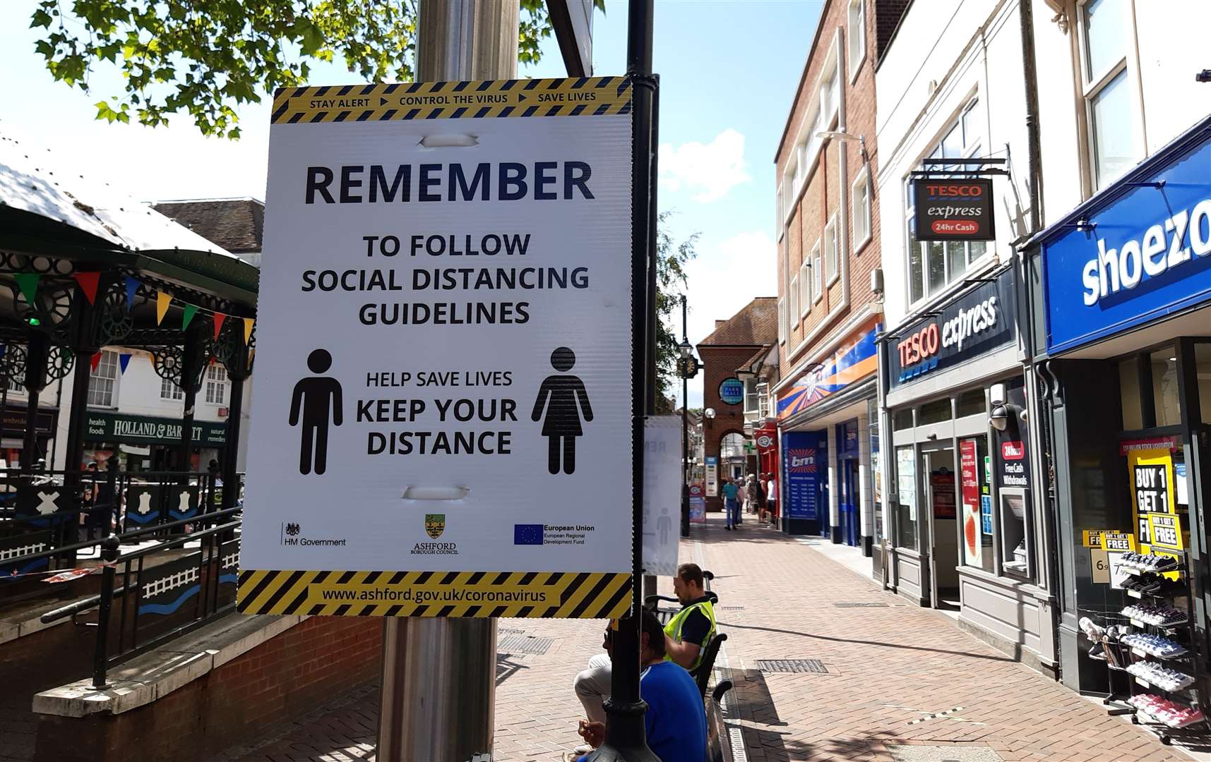 Signs in Ashford town centre encourage social distancing