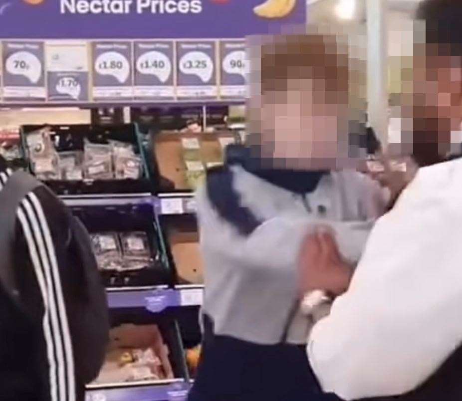 The video shows the boy pushing the security guard inside the Sainsbury’s store. Picture: @crime.ldn on Instagram