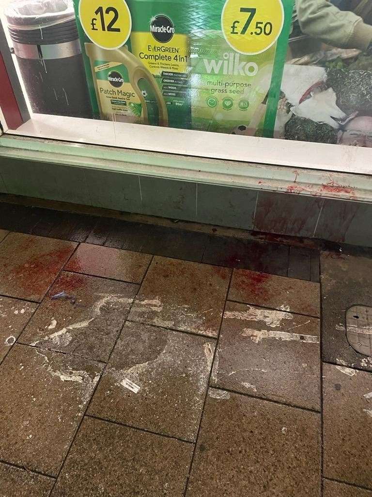 Blood on the pavement and up the walls outside Wilko in Gillingham High Street