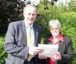 Cllr Jane Marriott handing the petition to Ashford MP Damian Green