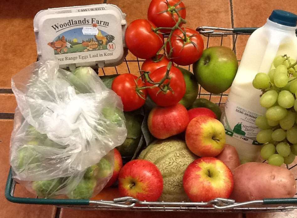 A shopping basket full of fruit and vegetables from Macknade Fine Foods.