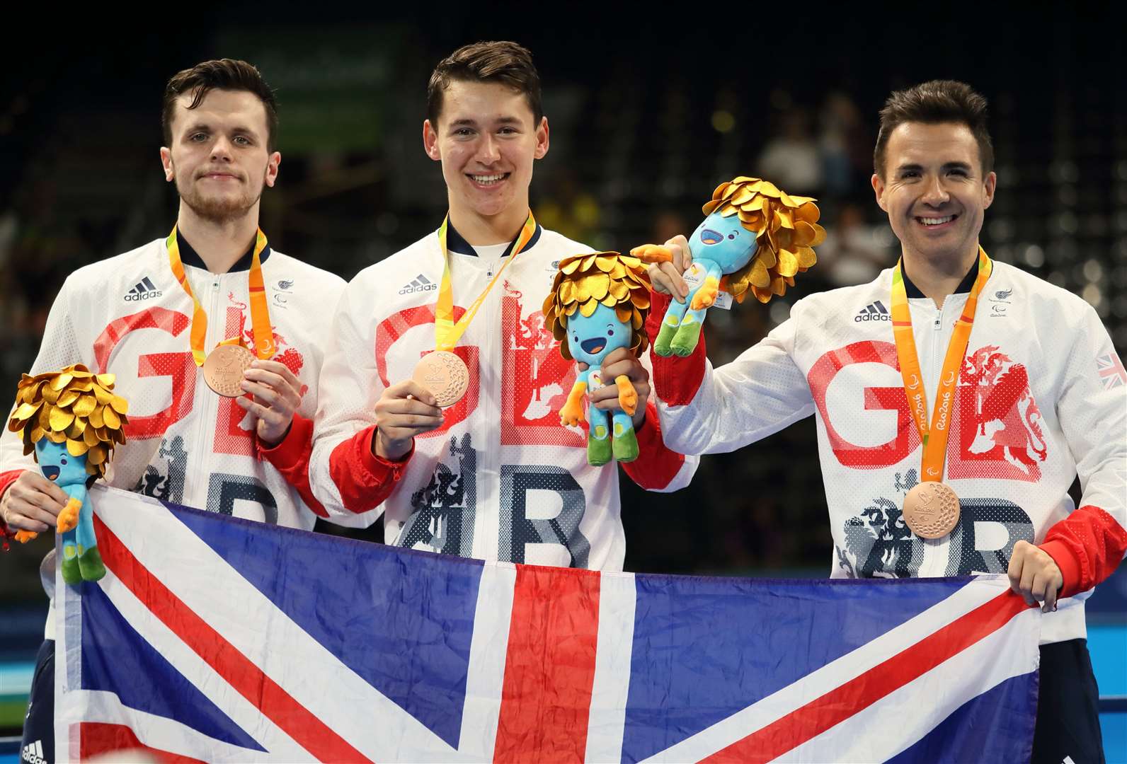 Will Bayley, right, celebrates medal success with ParalympicsGB team-mates Aaron McKibbin and Ross Wilson at Rio 2016 Picture: onEdition