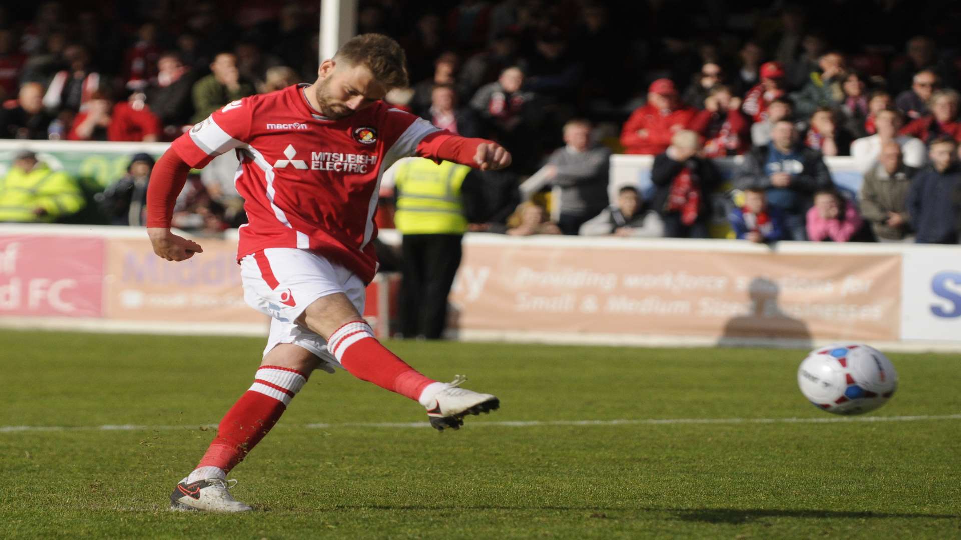 Matt Godden scores during the penalty shoot-out against Maidstone Picture: Gary Browne