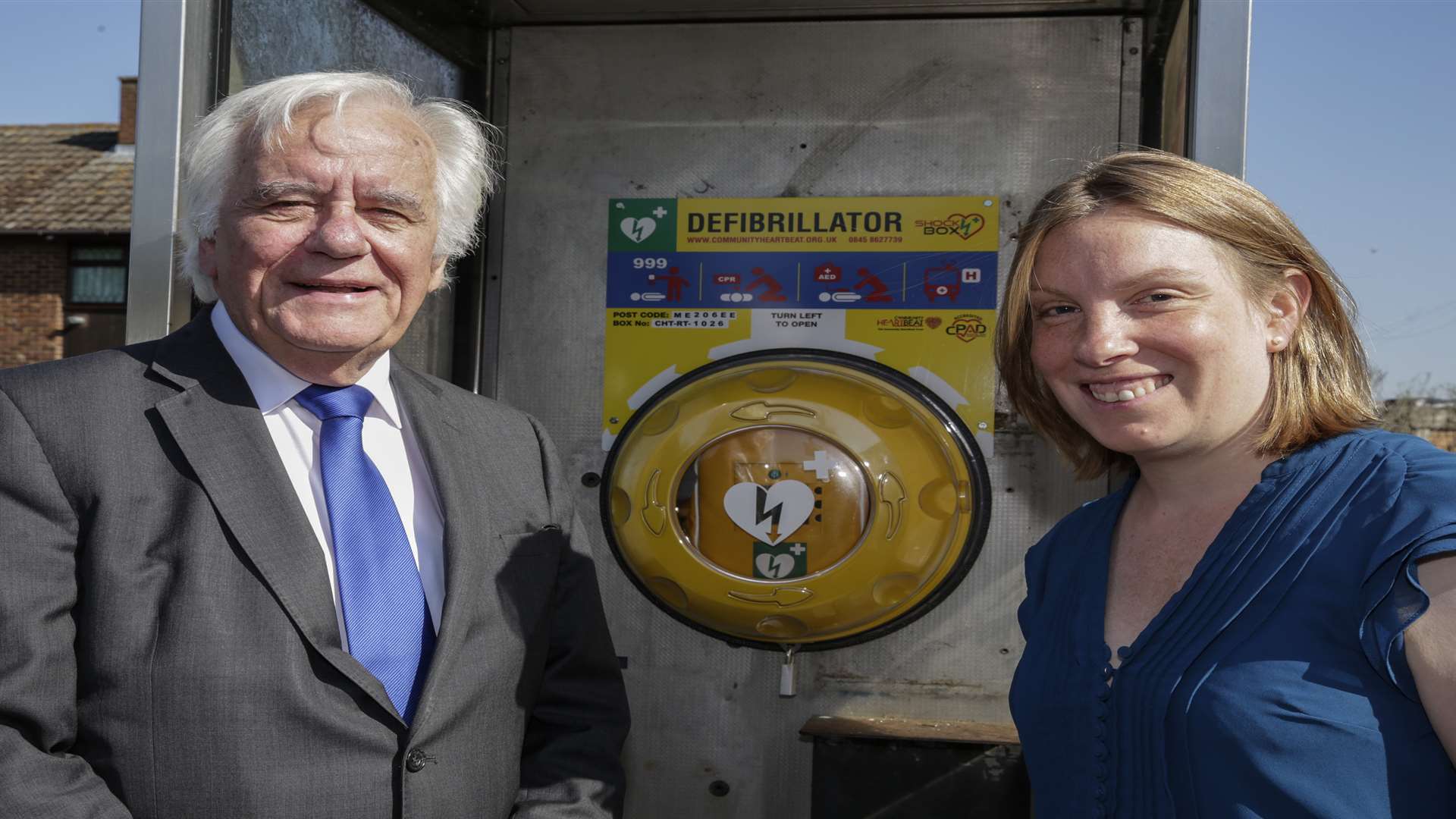 Peter Homeward county councillor and Tracey Crouch MP unveiling a public defibrillator situated in a phone box for emergencies