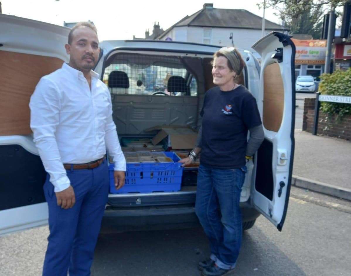 From left: Saif Islam and volunteer from Gillingham Street Angels with a van of meals supplied by the restaurant. Picture: Saif Islam