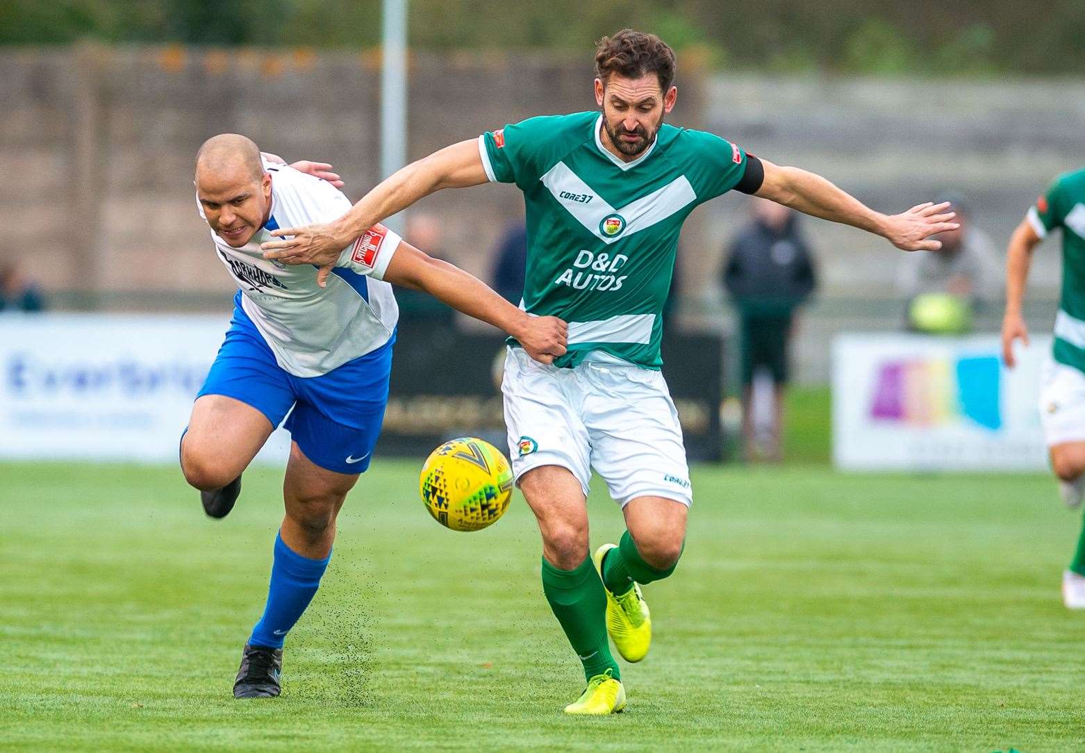 Jay May brushes off Tom Wynter in Ashford's 4-0 win over Hythe Picture: Ian Scammell