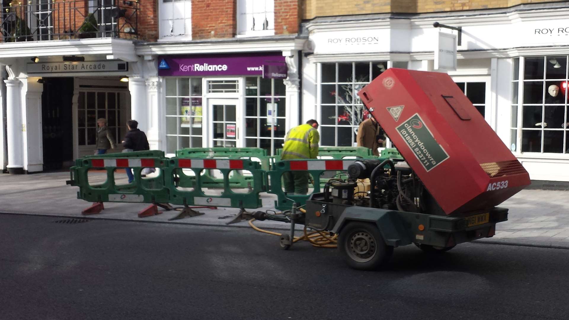 Workmen began digging up the pavement this afternoon
