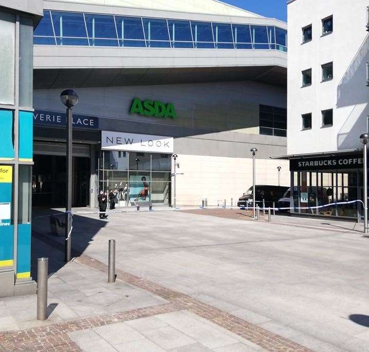 The front of Asda in Bouverie Place has been cordoned off