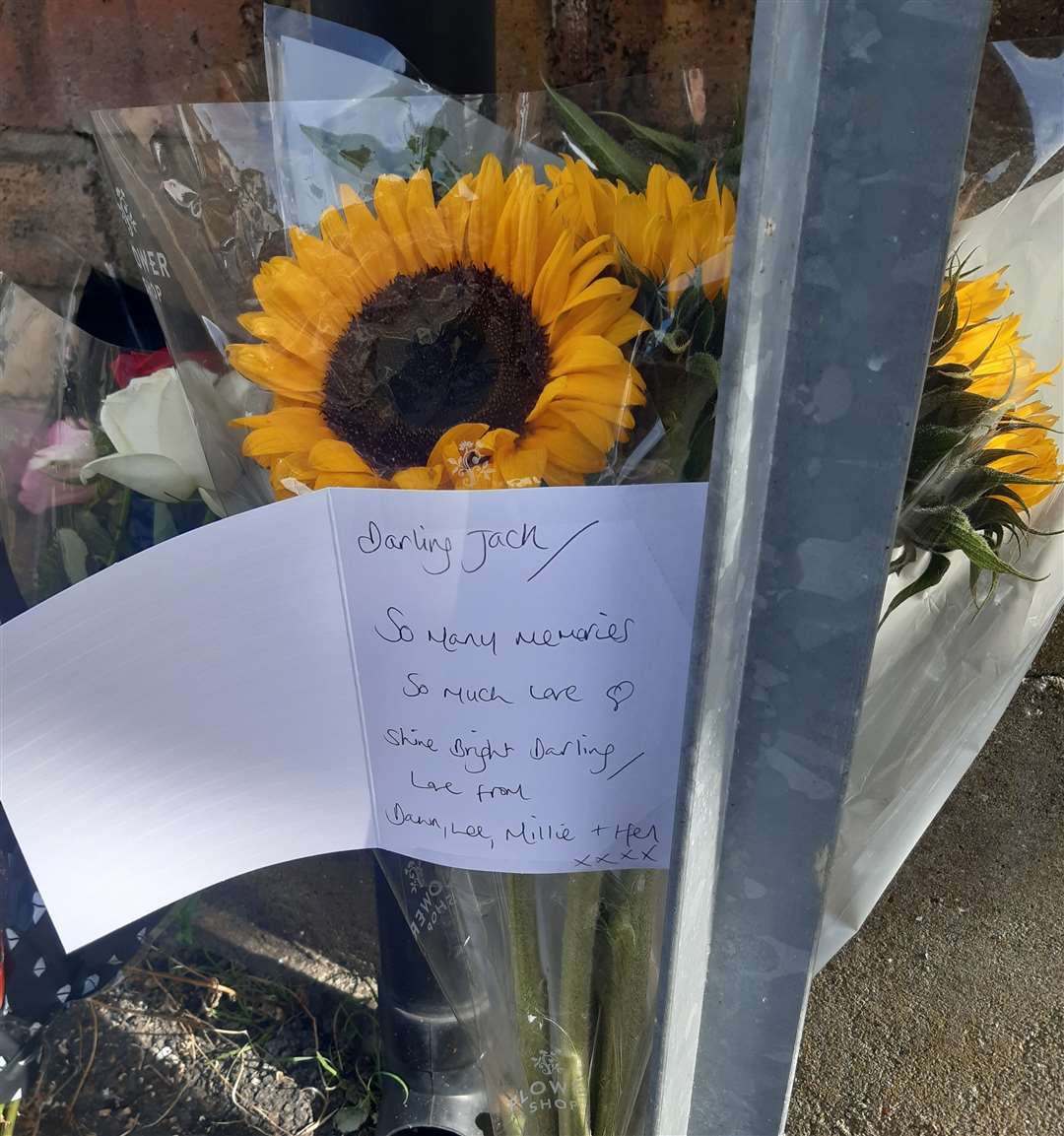 Tributes were laid near the place where Mr Bruce died after colliding with a bin lorry