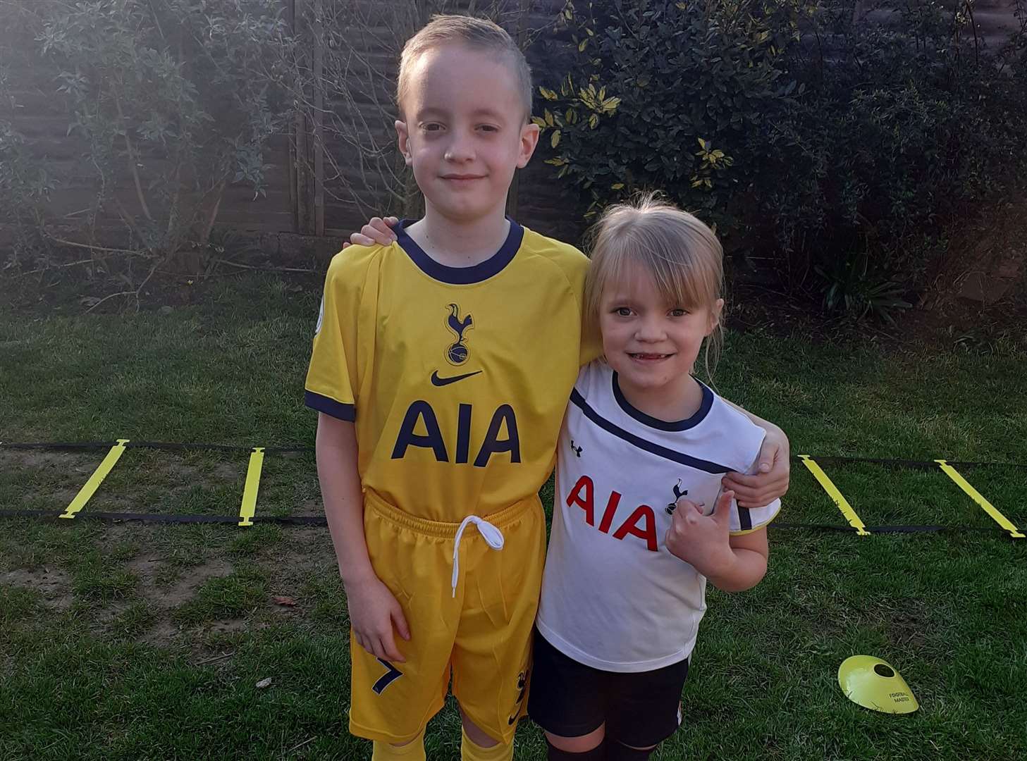 Kian, 11, with his sister Esmae, 7, are both huge football fanatics. Picture: Vicky Holt