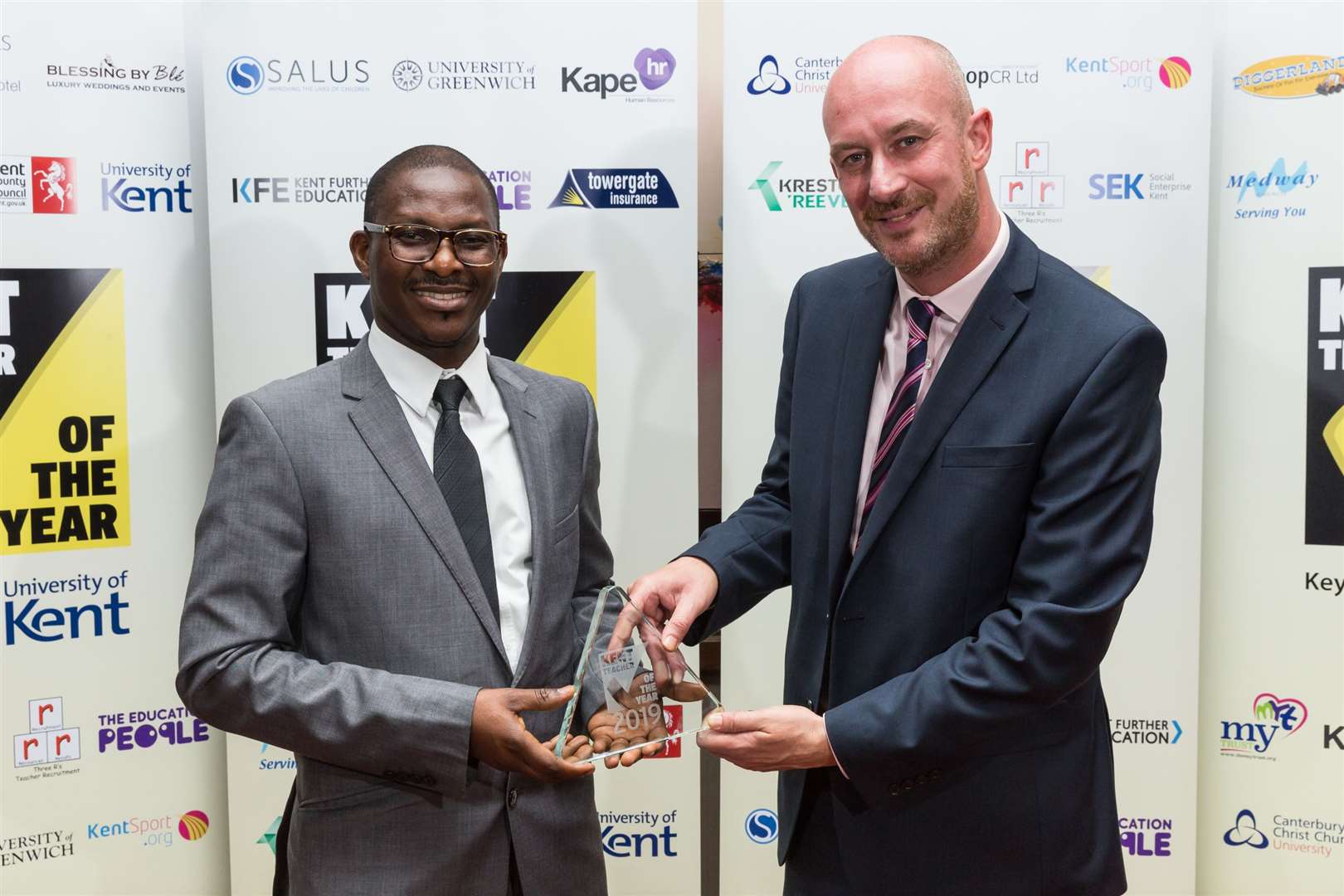 from left, Thomas Nyaku Overall Kent Mathematics Teacher of the Year of Dartford Science and Technology College. University of Kent â John Crook. Kent Teacher of the Year 2019 awards. Ashford International Hotel, SimonÃ© Weil Avenue, Ashford. .Picture Submitted by: Martin Apps.KM Group has permission to sell this image via photo sales and to re-sell the image to other media for single-use publication.. (10146168)