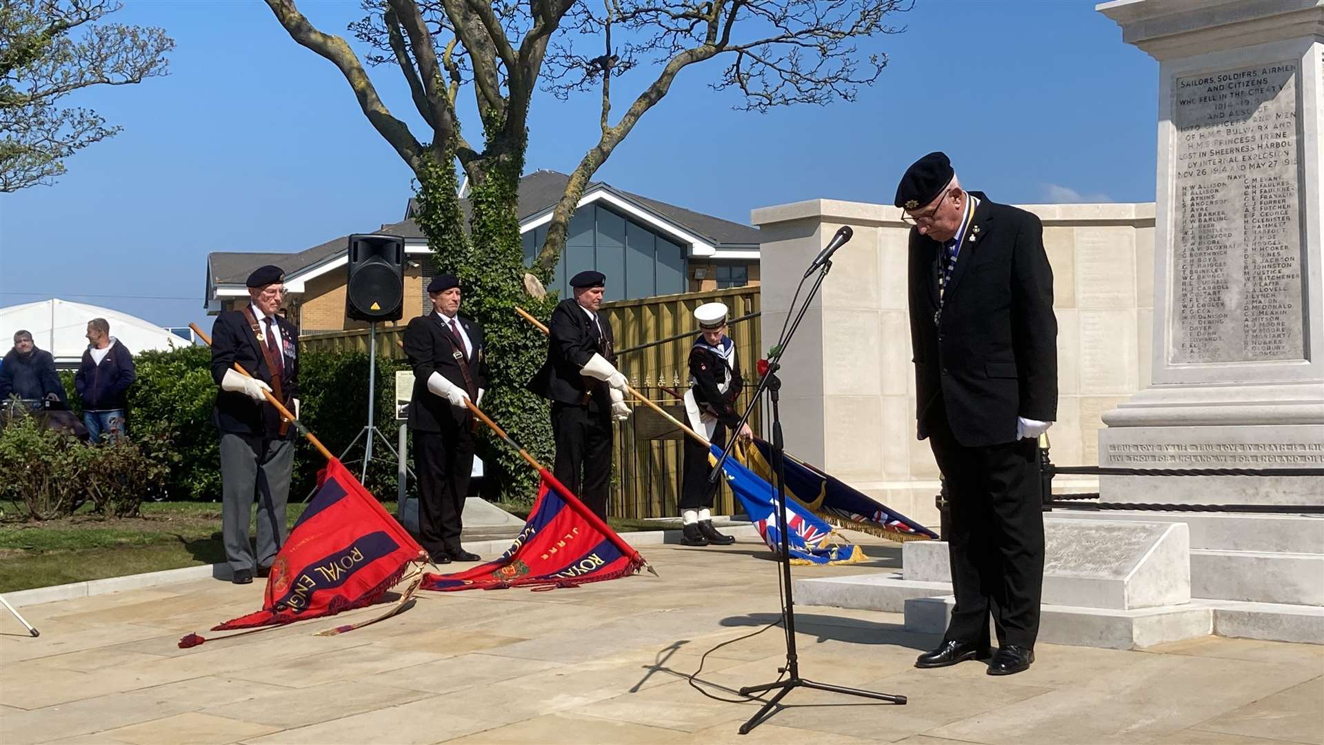 Colours lowered for a two minutes silence at the dedication of the new memorial wall in Sheerness
