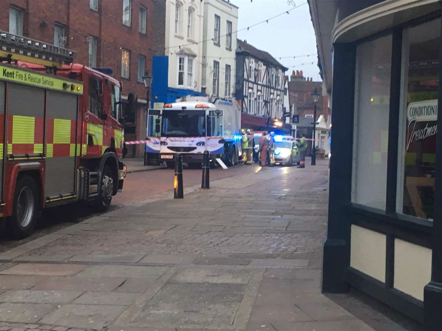 The emergency services in Rochester High Street after Russell Lane was tipped into a bin truck