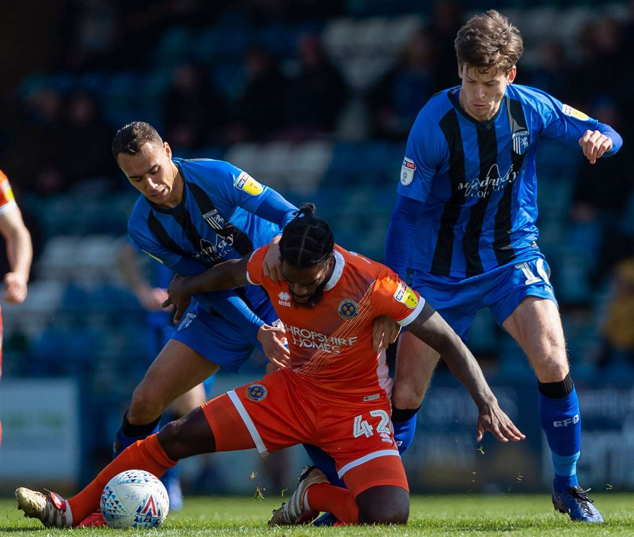 Gillingham's Graham Burke and Billy Bingham challenge with Shrewsbury's Anthony Grant. Picture: Ady Kerry