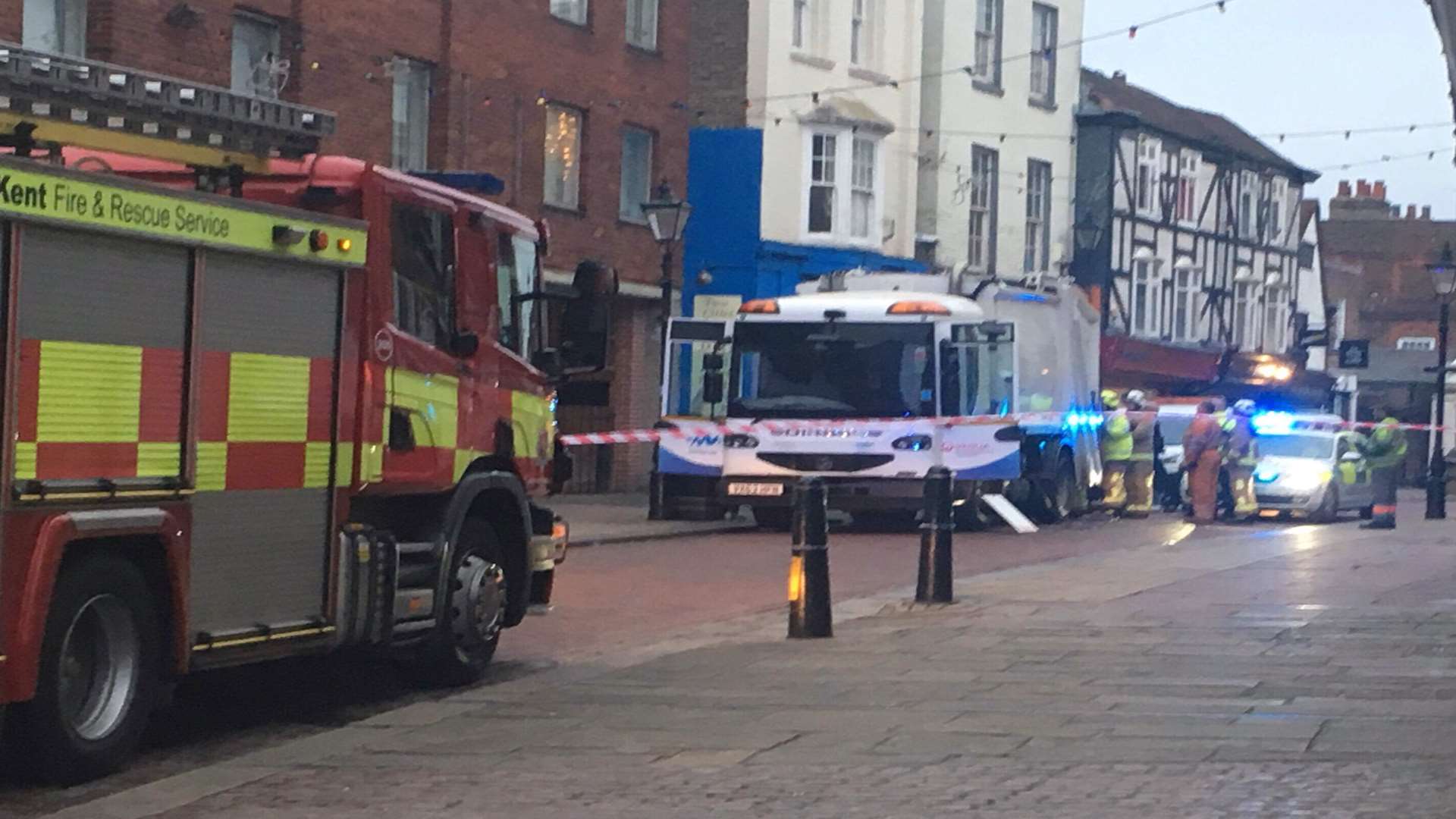 The bin lorry and fire engine in Rochester High Street