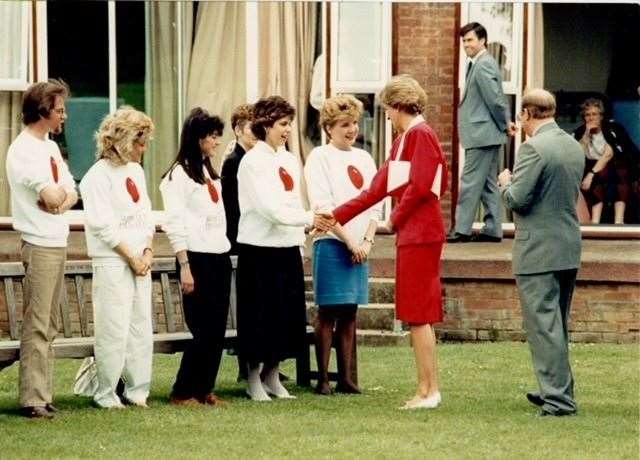 Katie shaking hands with Princess Diana at Papworth Hospital in 1988