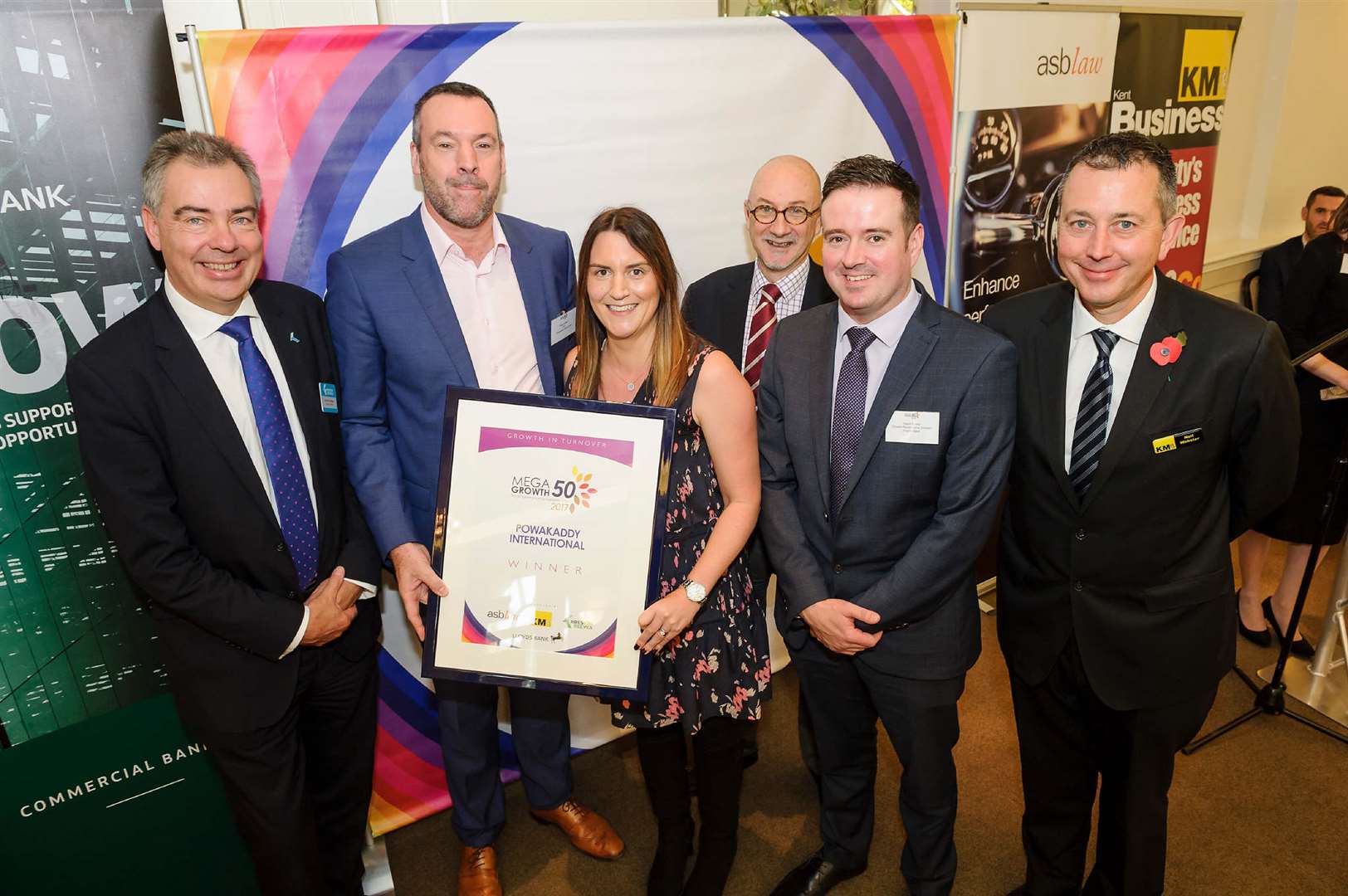 PowaKaddy boss David Catford, second left, picks up the MegaGrowth 2017 winner's certificate with, from left, Andrew Griggs of Kreston Reeves, wife Adele, Shaun Kelly of asb law, Gavin Potter of Lloyds Bank and Neil Webster of KM Group