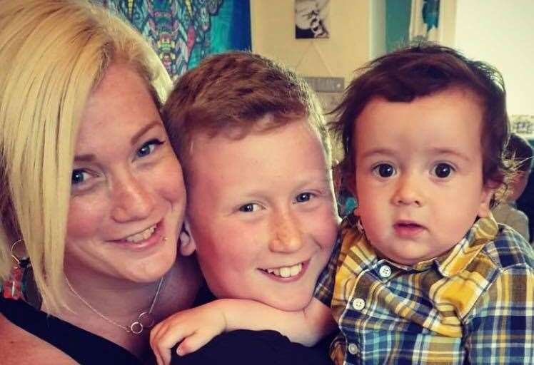Logan on his first birthday with his mum Kelly Williams and his nine-year-old brother Tyler