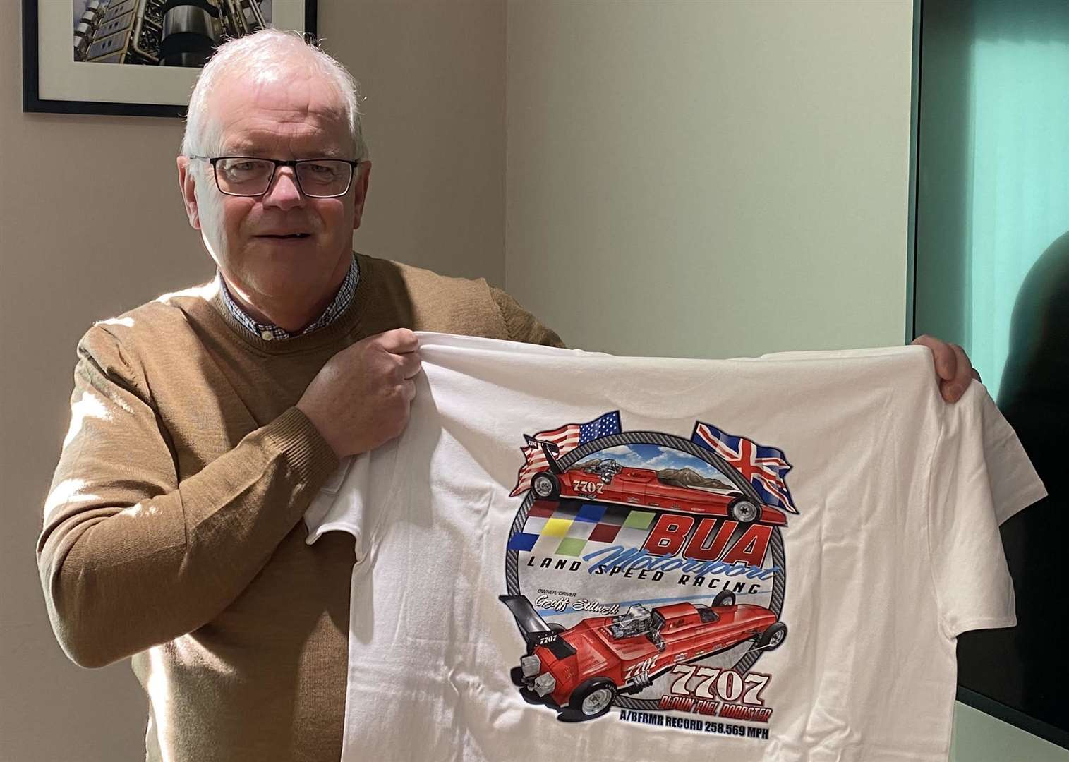 Geoff Stilwell with one of his racing team's shirts. Picture: Geoff Stilwell