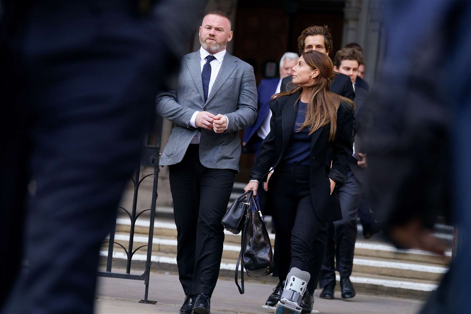 Wayne and Coleen Rooney leave the Royal Courts of Justice on Tuesday (Victoria Jones/PA)