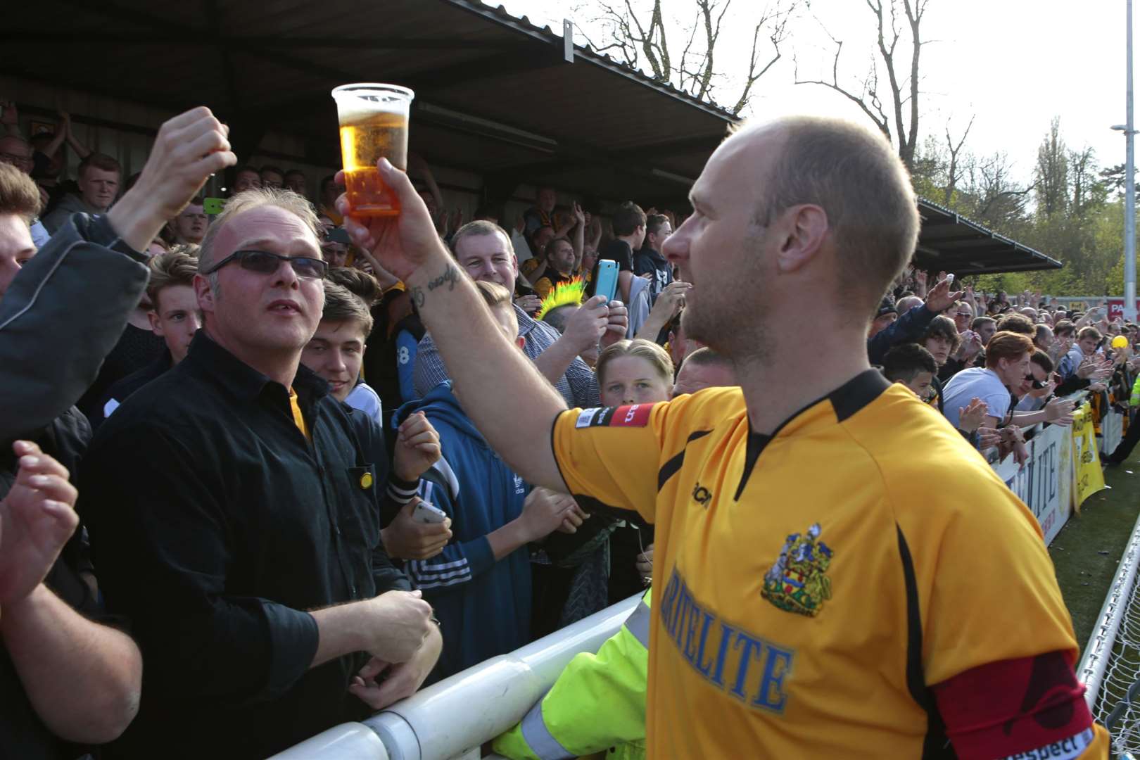 Steve Watt raises a pint to Maidstone United fans in 2015, after they finish as champions of the Isthmian League - but more promotions could stop the beers flowing at the club.