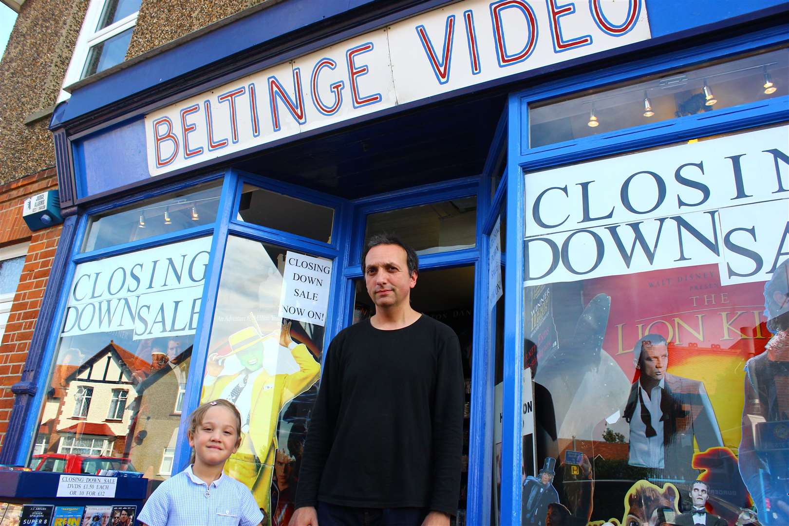 Giles Hando - pictured with his daughter Isabella - is closing his Beltinge Video store. Picture: Joe Wright