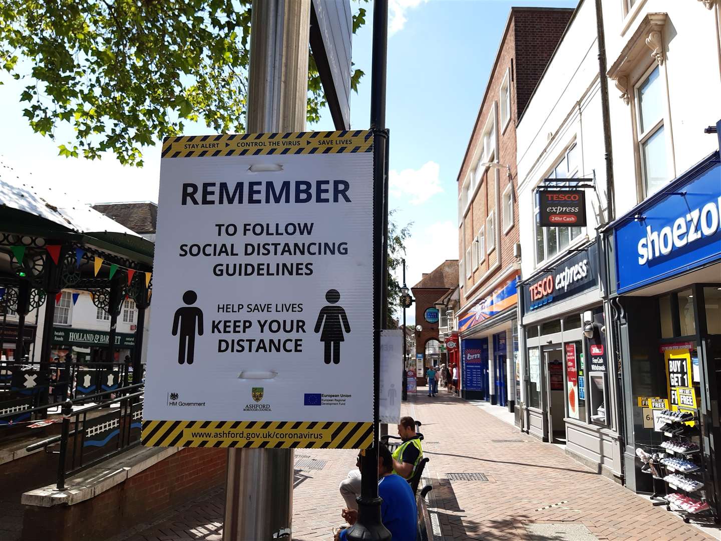 Signs to remind shoppers of the need for social distancing were a common sight on high streets like Ashford.