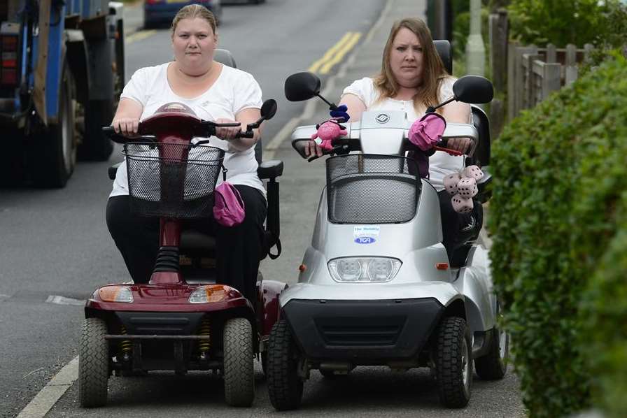 Side by side, Sandra Reed and mother Emma ride on the pavement in Ashford