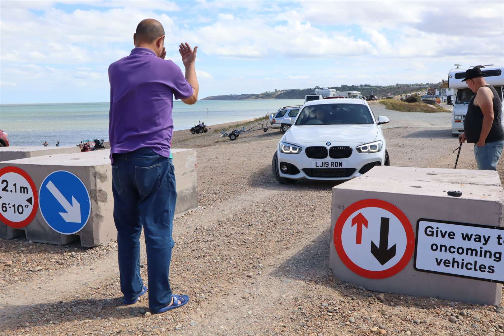 Careful does it: this passenger was giving his driver instructions as she navigated the double bollards on the shingle bank at Minster, Sheppey. Picture: John Nurden