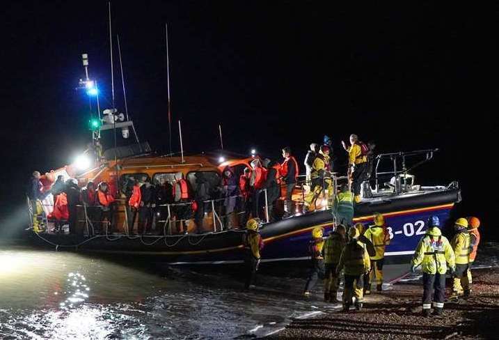 A group of people being helped by an RNLI lifeboat at Dungeness following a small boat incident in the Channel. Picture: Gareth Fuller/PA