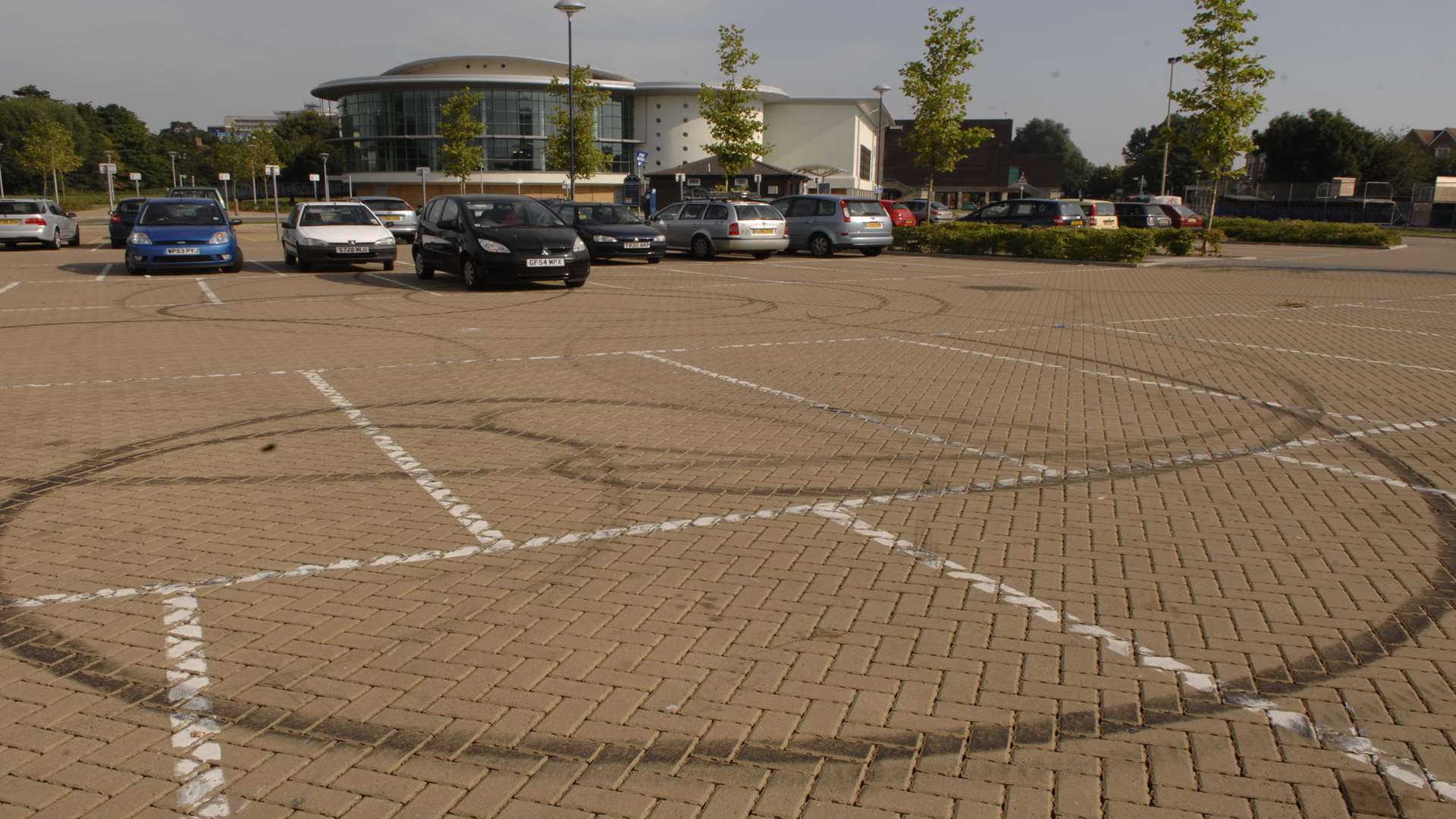 Tracks in the car park left by boy racers