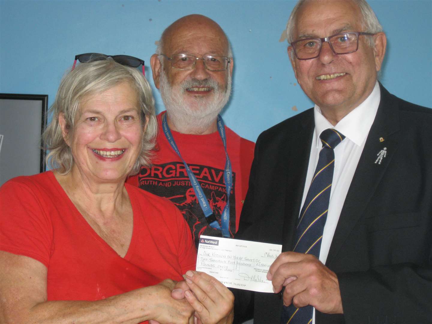 Mason Ralph Apperley presenting a cheque to Sharon Goodyer of the Summer Kitchen with Councillor Barry Lewis