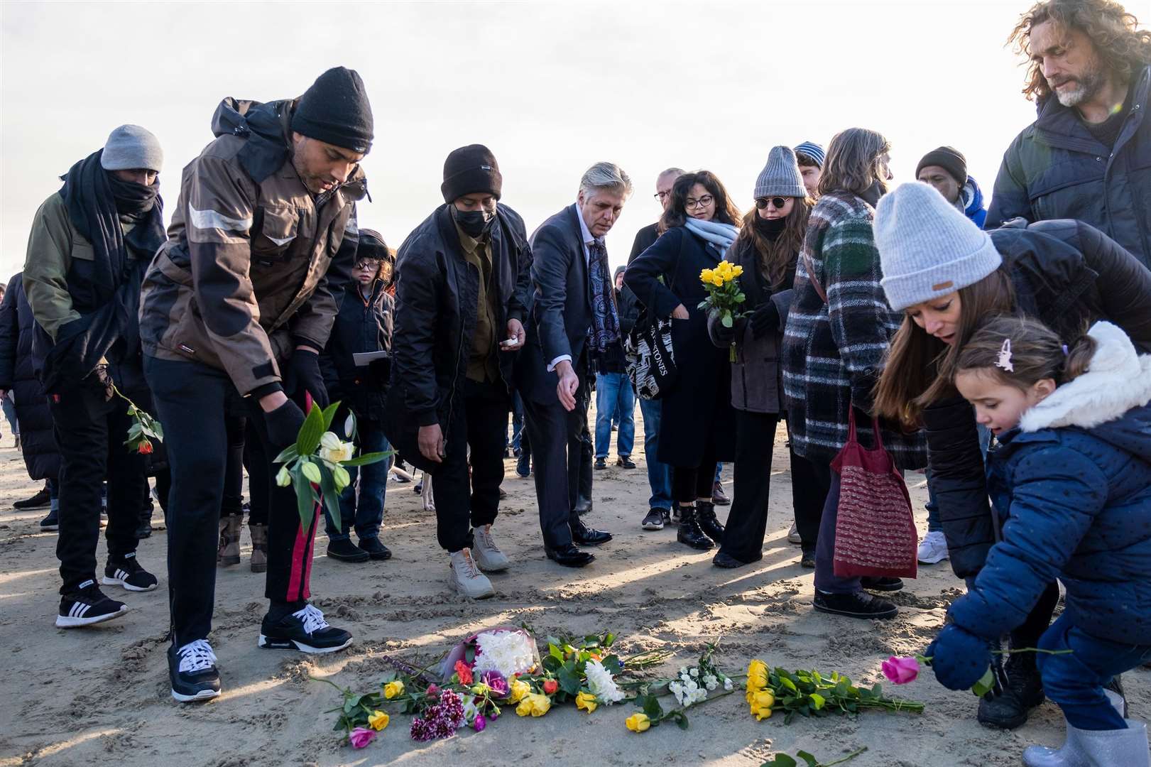 People lay flowers on the sand on Folkestone beach. Picture: Andy Aitchison