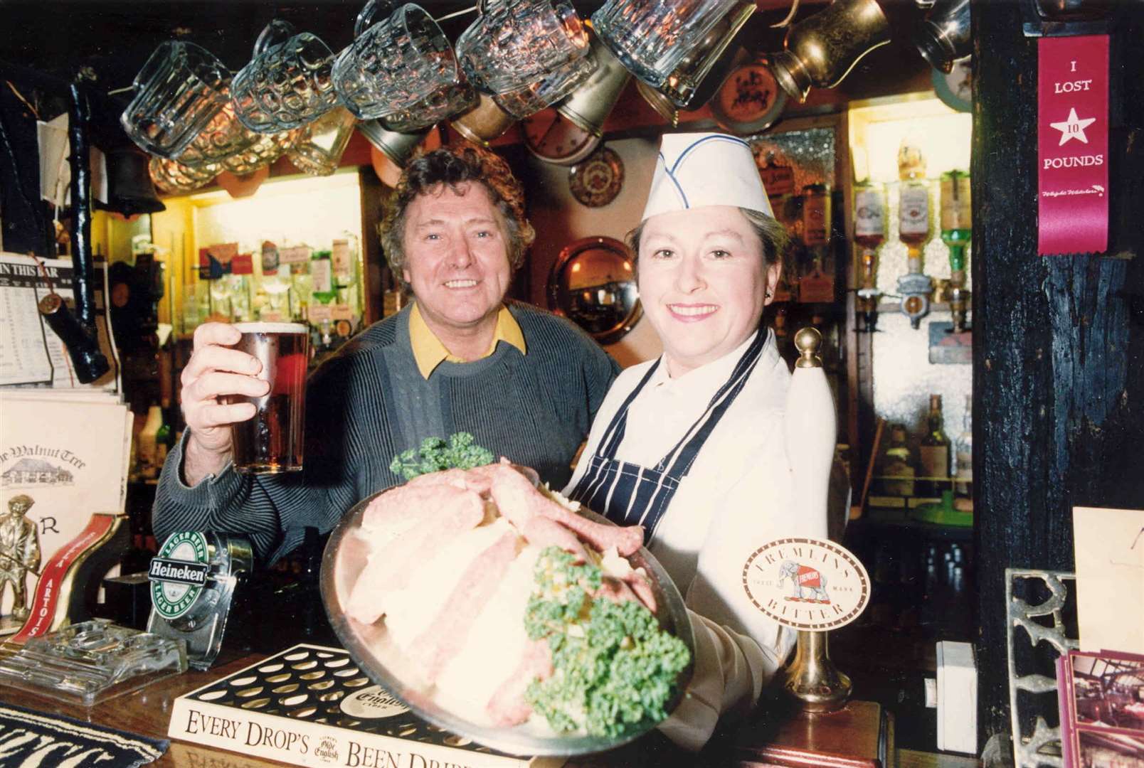 Ron and Linda Russell behind the bar at the Walnut Tree public house in Yalding in 1992. The historic pub, built in 1492, has now reopened in line with the latest government guidelines