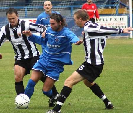 Andy Martin flanked by two Tooting defenders during his days at Tonbridge. Picture: DAVID COULDRIDGE