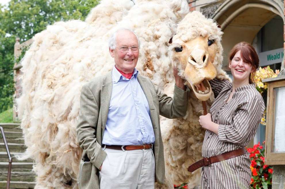 Curator Louise Emily Thomas leads Gobi the Camel with John Hare who runs the charity