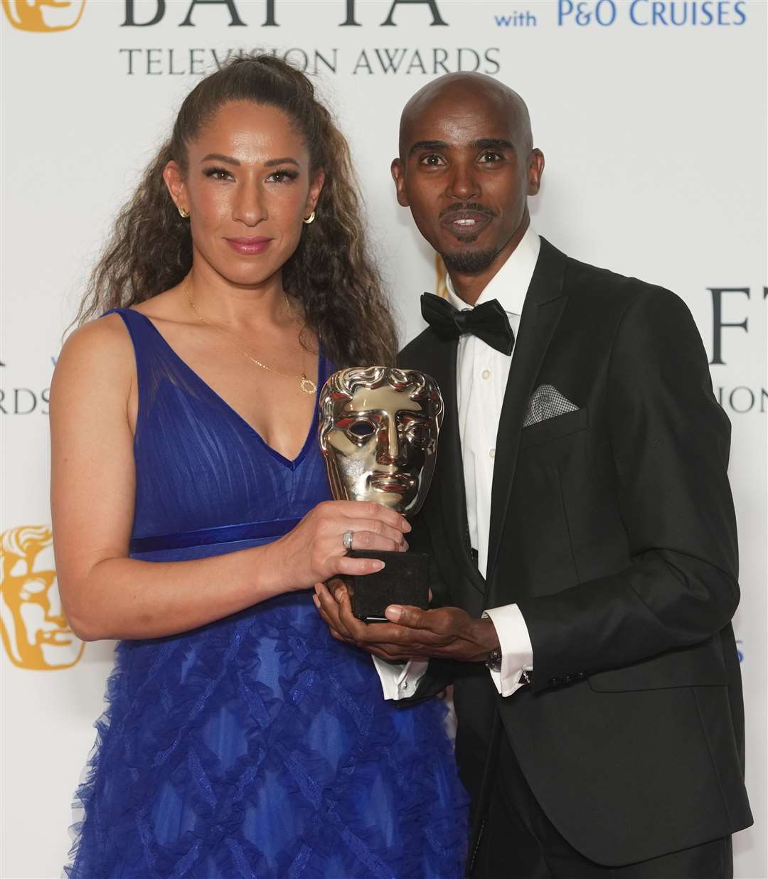 Sir Mo Farah and his wife Tania, with the award for Single Documentary, for The Real Mo Farah, at the Bafta Television Awards 2023 (Jeff Moore/PA)
