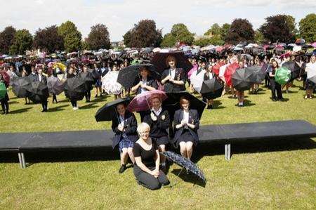 Pupils from Rochester Grammar School for Girls try to smash the world record for the biggest recorded umbrella dance
