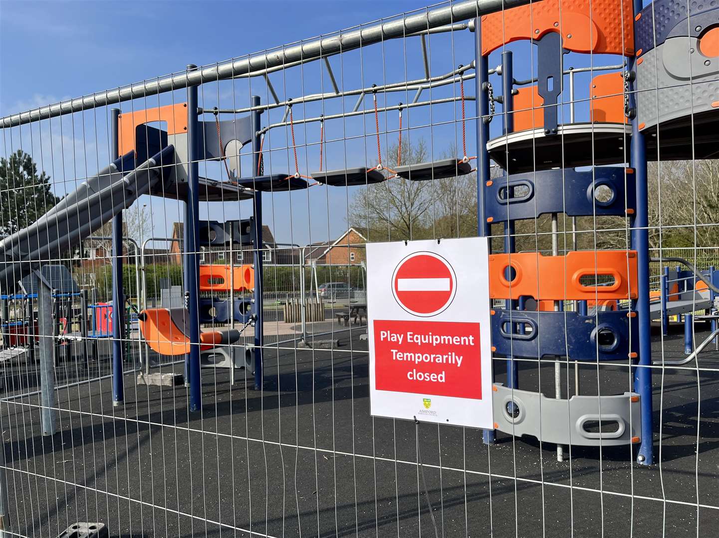Part of the play area is fenced off with a sign saying 'play equipment temporarily closed'