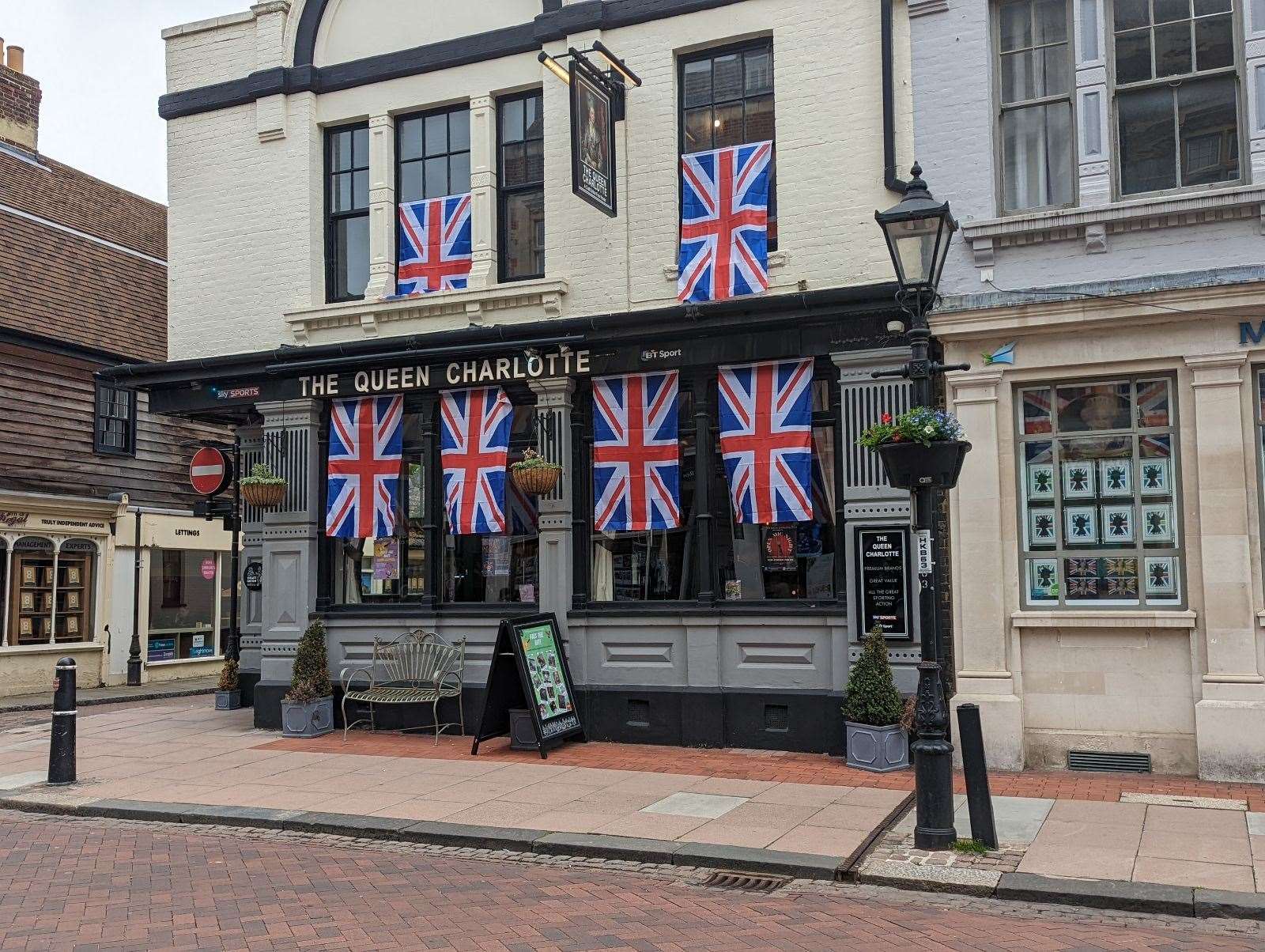 Union flags on The Queen Charlotte pub in Rochester High Street