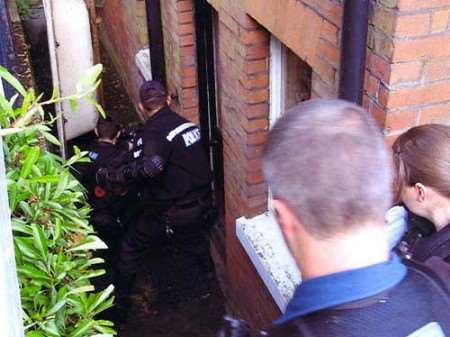 Officers prepare to search the property in Dover
