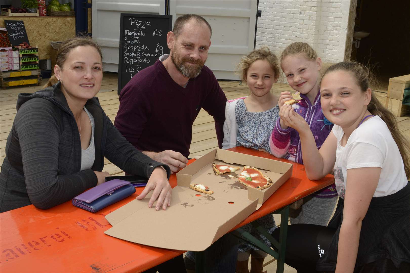 Nicola and Simon Maynard enjoyed their pizza with their children Isabelle, Sophie and Emily. Picture: Paul Amos. (15071195)
