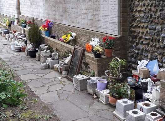 Mementos and flowers cleared from the memorial garden