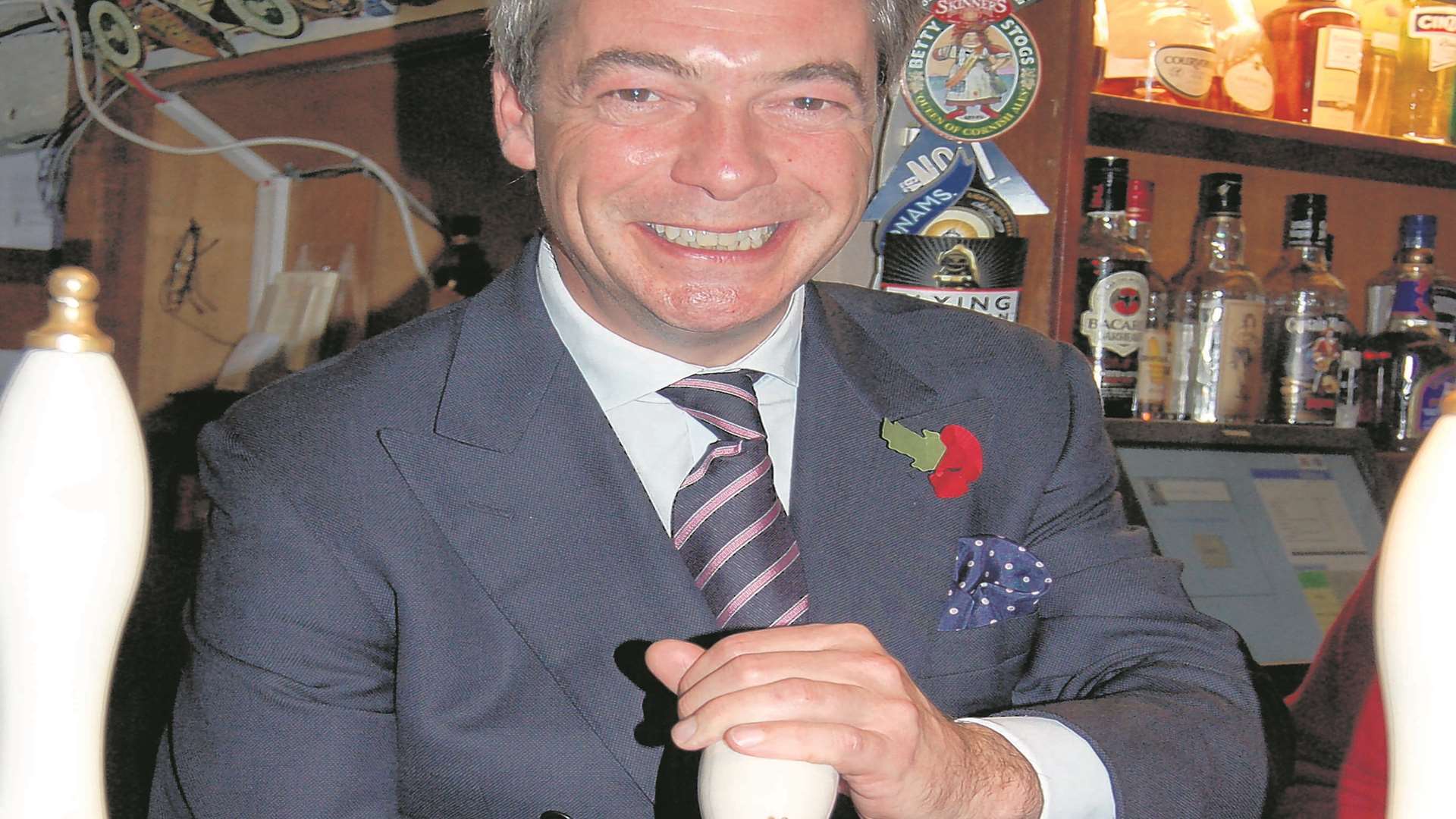 Nigel Farage pulls a pint during his election campaign