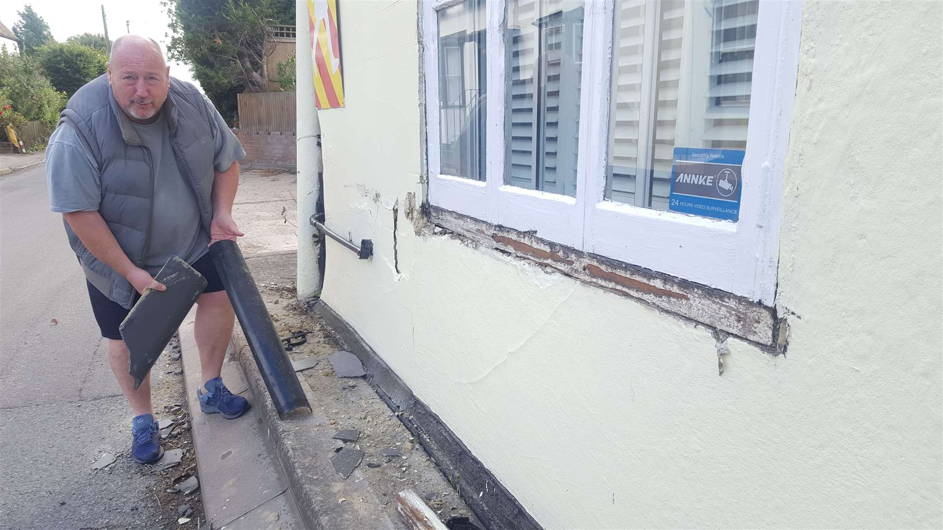 Mark Kilbey outside his damaged home