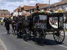 The hearse proceeds up to the church in Chapel Street. Funeral of PC Phillip Pratt, at the Minster Bethel Church, Chapel Street, Minster. Picture: Andy Payton