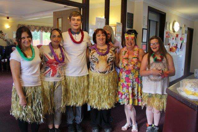 Staff at Pine Lodge care home in Sittingbourne during its Hawaiian-themed charity day