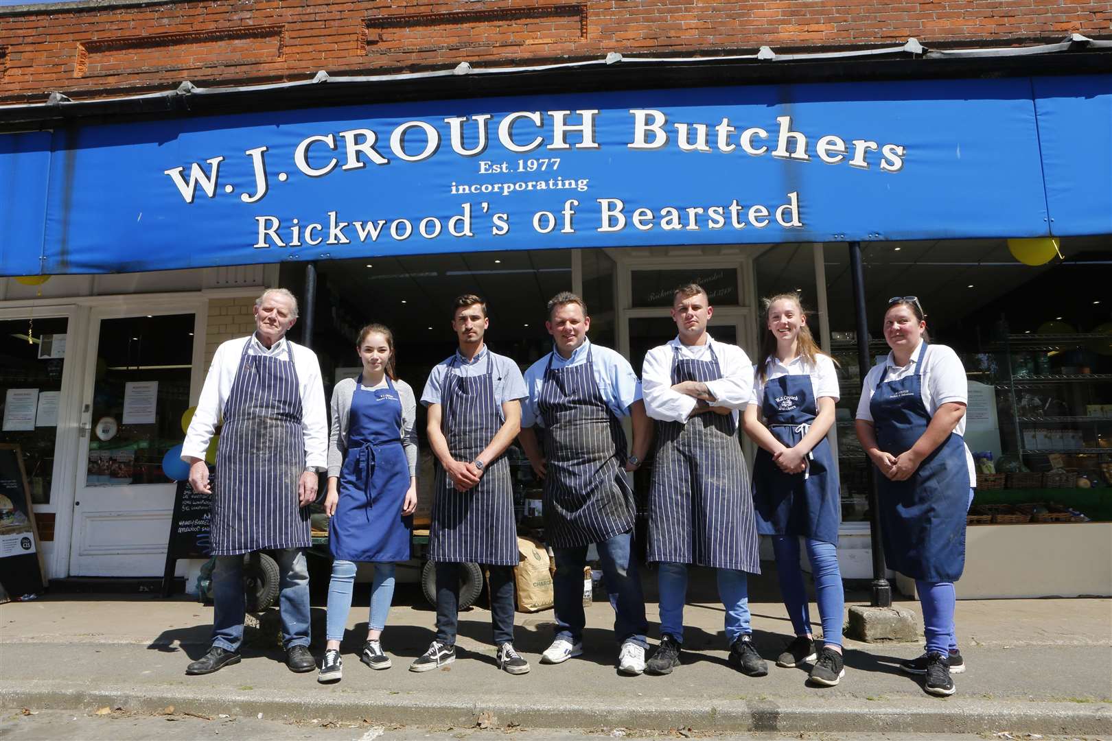 All smiles: The future of W.J.Crouch, Butchers, is secured after the family bought the freehold of the building