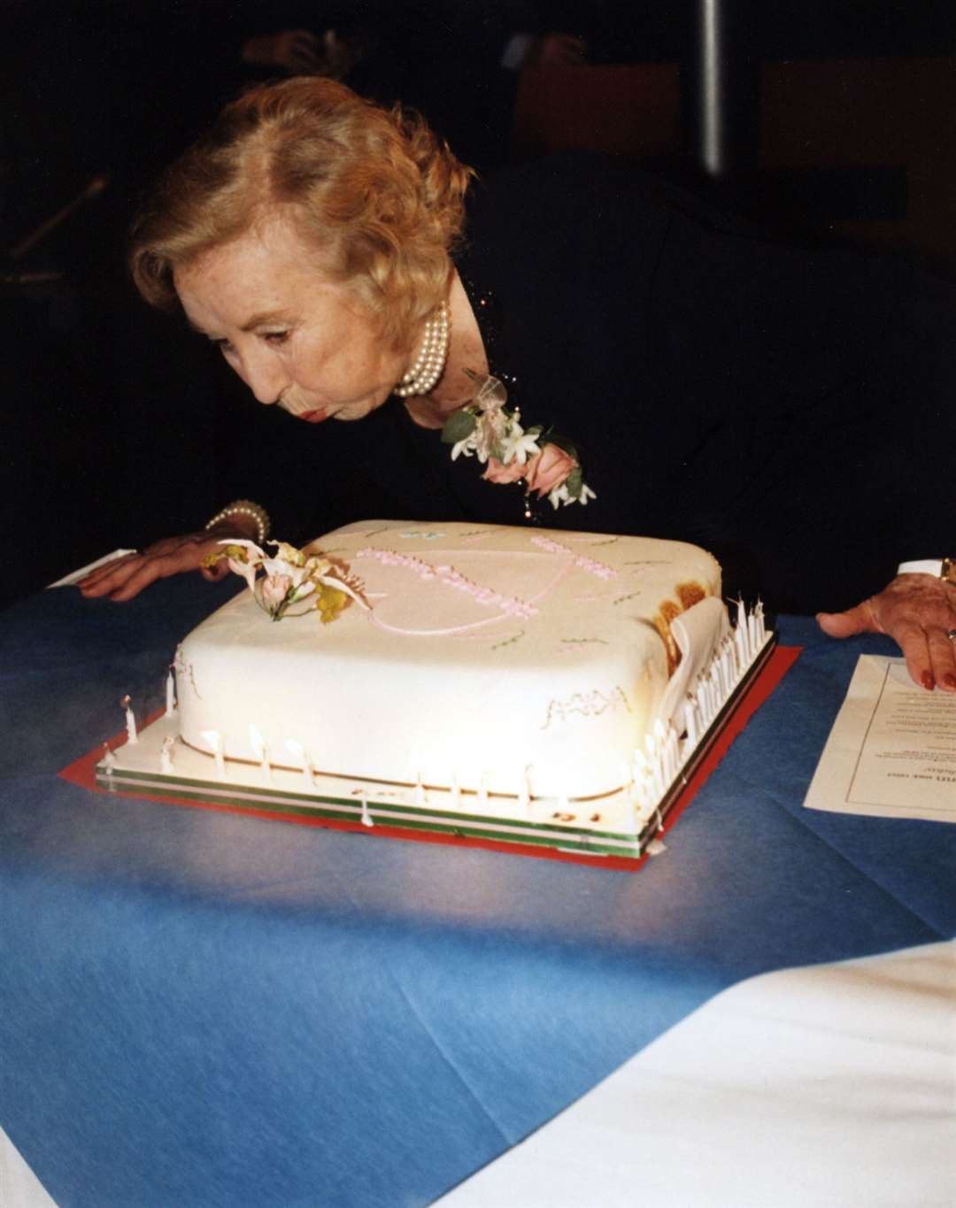 Blowing out birthday candles in 1997 at age 80 (PA)